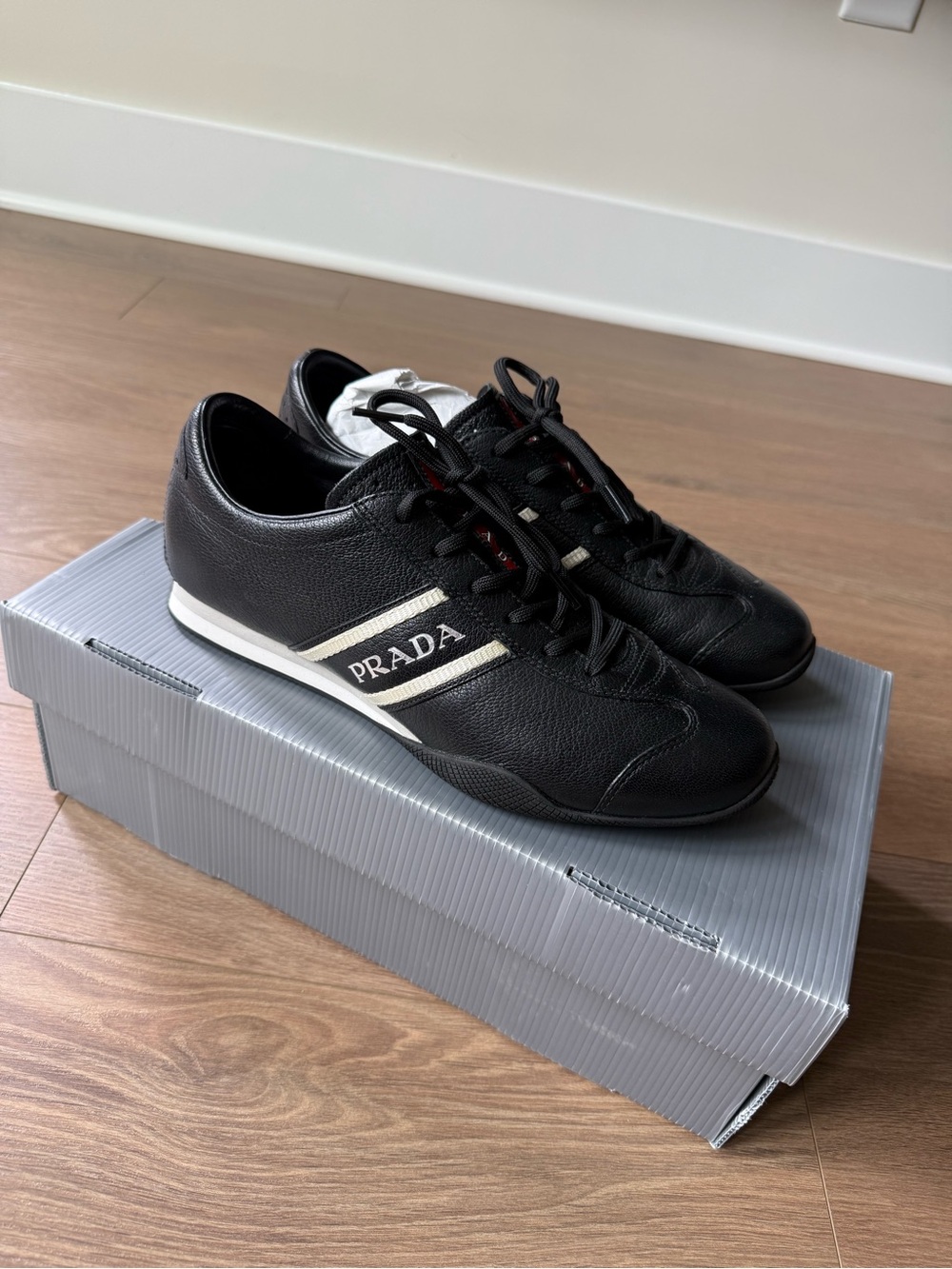 Prada Black Leather Sneakers with White Stripe